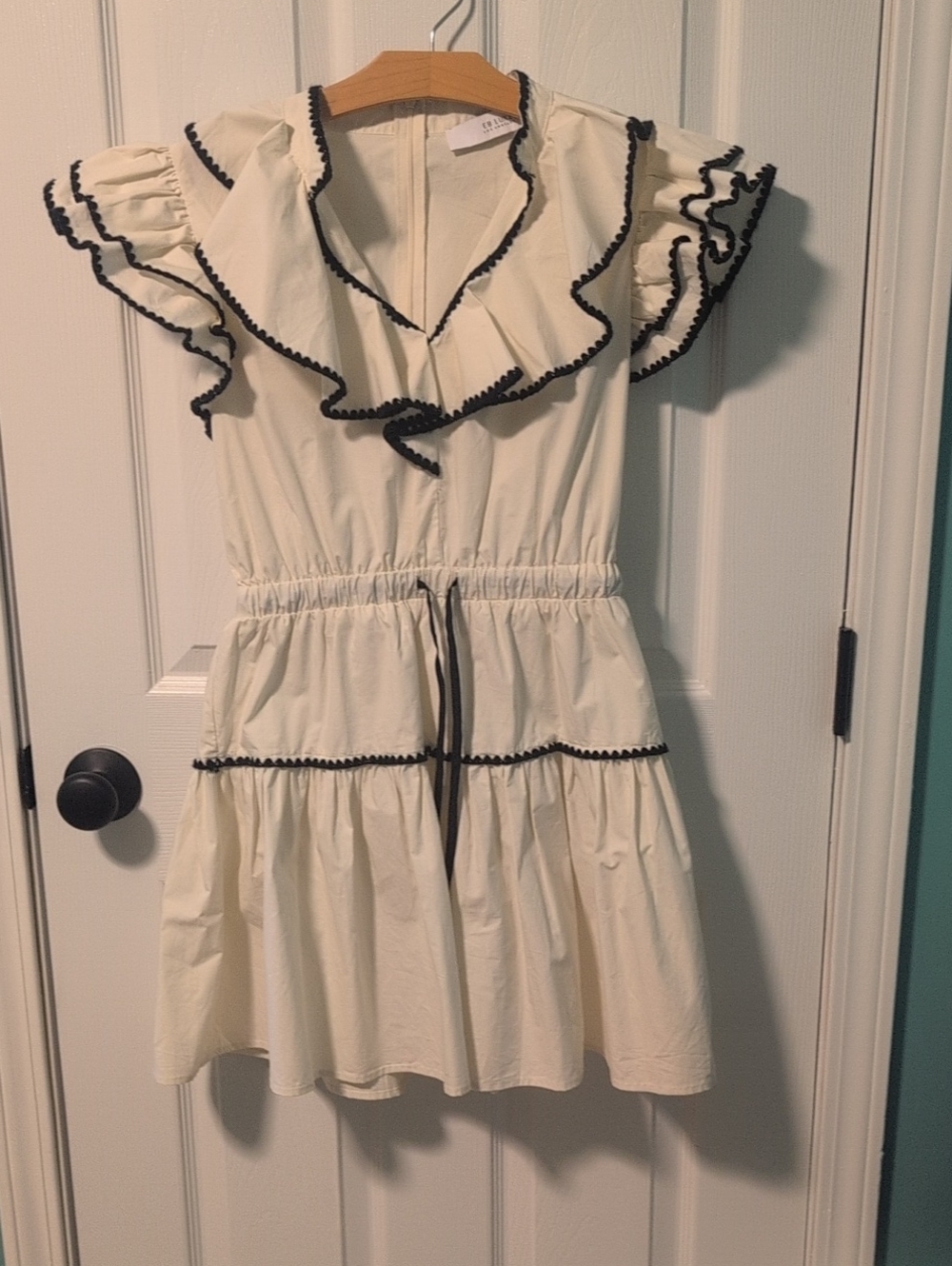 EB Luxe Cream Ruffle Dress with Black Trim
